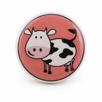 Pomello in ceramica con mucca su sfondo rosa visto frontalmente KID-16