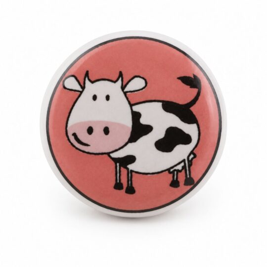 Pomello in ceramica con mucca su sfondo rosa visto frontalmente KID-16