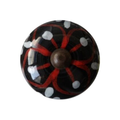 Vista frontale del pomello vintage in ceramica nera con decoro rosso e bianco CK-541