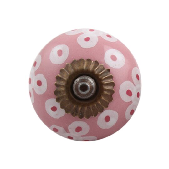 Pomello rosa in ceramica con pois bianchi visto frontalmente