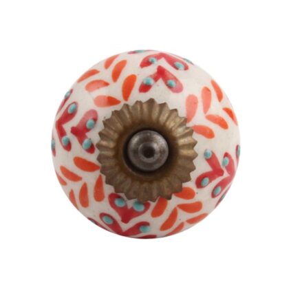 Pomello floreale in ceramica rosso e arancio visto frontalmente